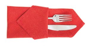 red cloth napkins with silverware enclosed