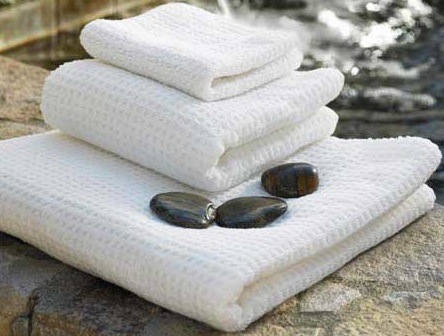 Stack of white towels on a table